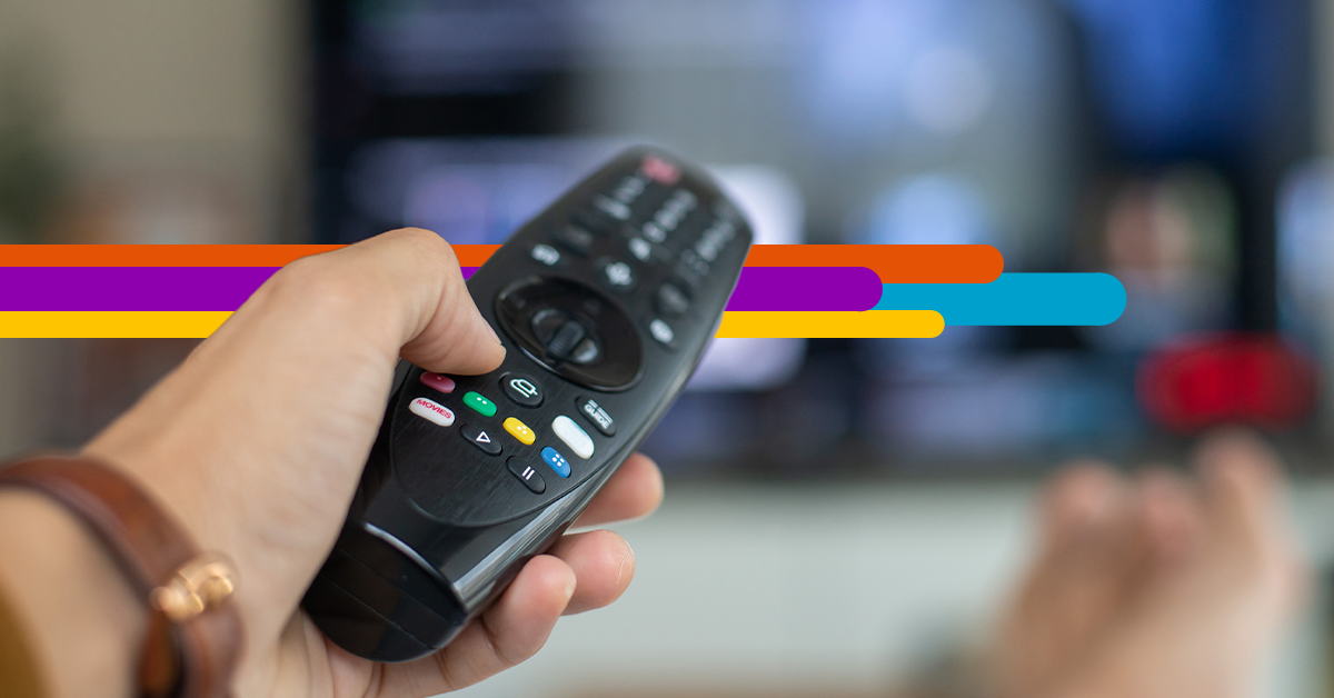 hand pointing remote at TV with i3 Broadband fiber strands